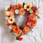 Orange flowers heart wreath